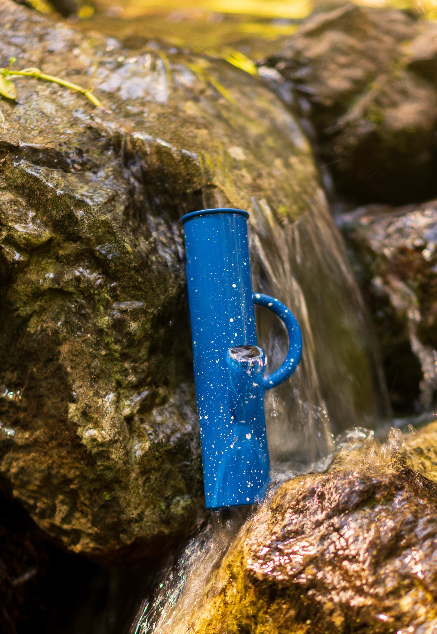 We are giving away a Blue-speckled Titanium DangleBong Enamel Camp Bong!